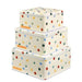 Trio of square off white stacked cake tins with a pastel coloured polka dot design repeated all over the tins, with an orange Emma Bridgwater label printed on each tin in the corner
