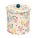 A off white biscuit tin with pastel coloured hens printed repeatedly around the tin with matching pastel coloured polka dots.