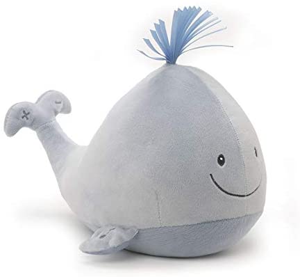 A light Blue Plush whale with a happy smile 