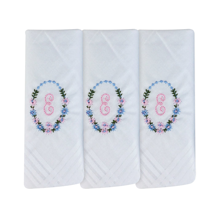 Three pack of white handkerchiefs displaying an embroidered letter E in pink with a floral boarder around the letter.