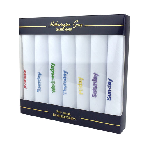 Set of 7 rolled handkerchiefs in a gift box with a day of the week embroidered on each handkerchief in a different coloured embroidery 