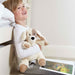 young boy holding warmies heat up puppy dog soft toy
