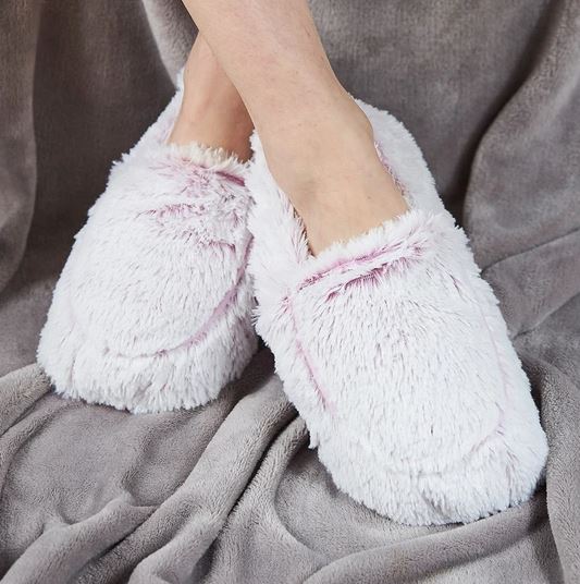 warmies heat-up soft slippers in pink being worn