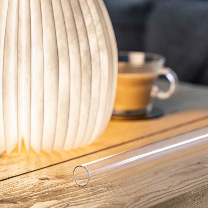 Gingko LED Vase Lit Up With Waterproof And Heat Proof Inner Tube Shown On A Coffee Table