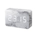 Gingko brick LED click clock in a white marble effect displaying the time in white